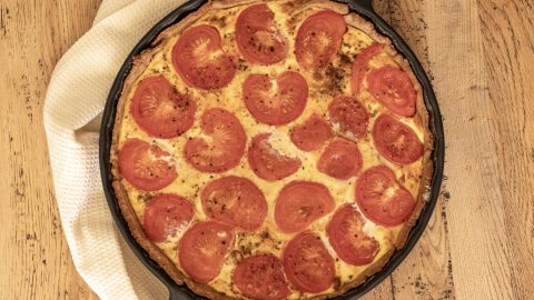 Sausage and tomato quiche seen from above