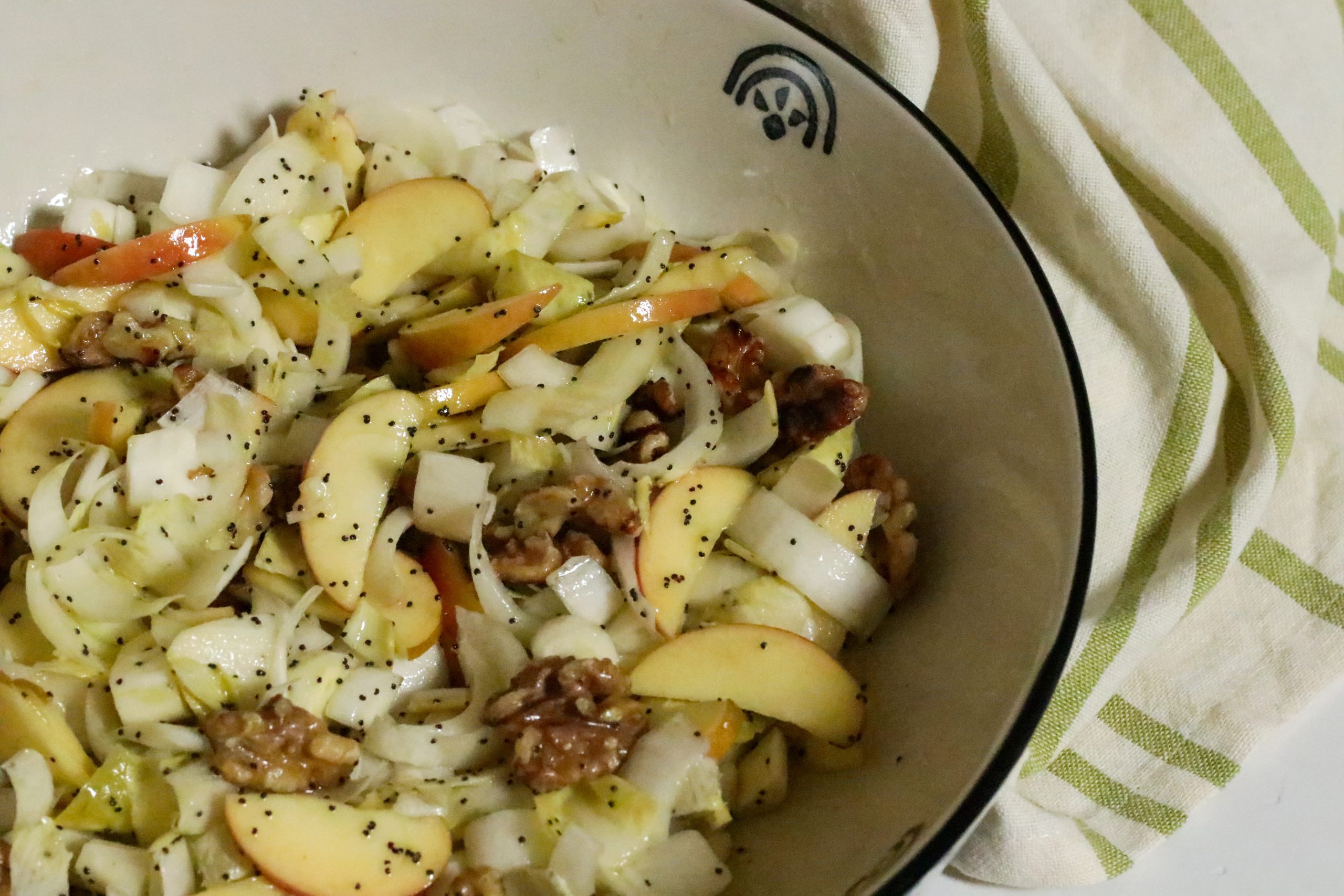 Endive Salad with Apple and Walnut served in a big ceramic bowl, ready to eat
