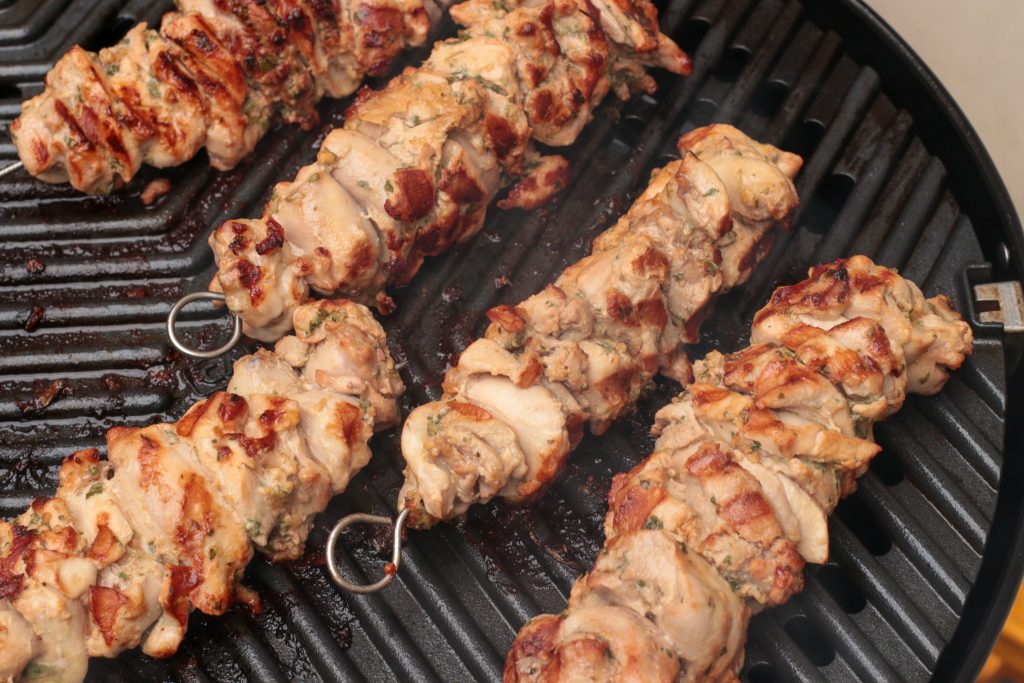 partially cooked chicken skewers with lemon and garlic marinade