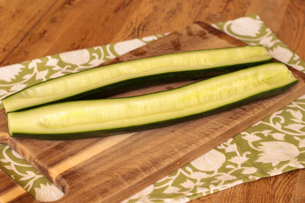 cucumber, deseeded on a wooden board