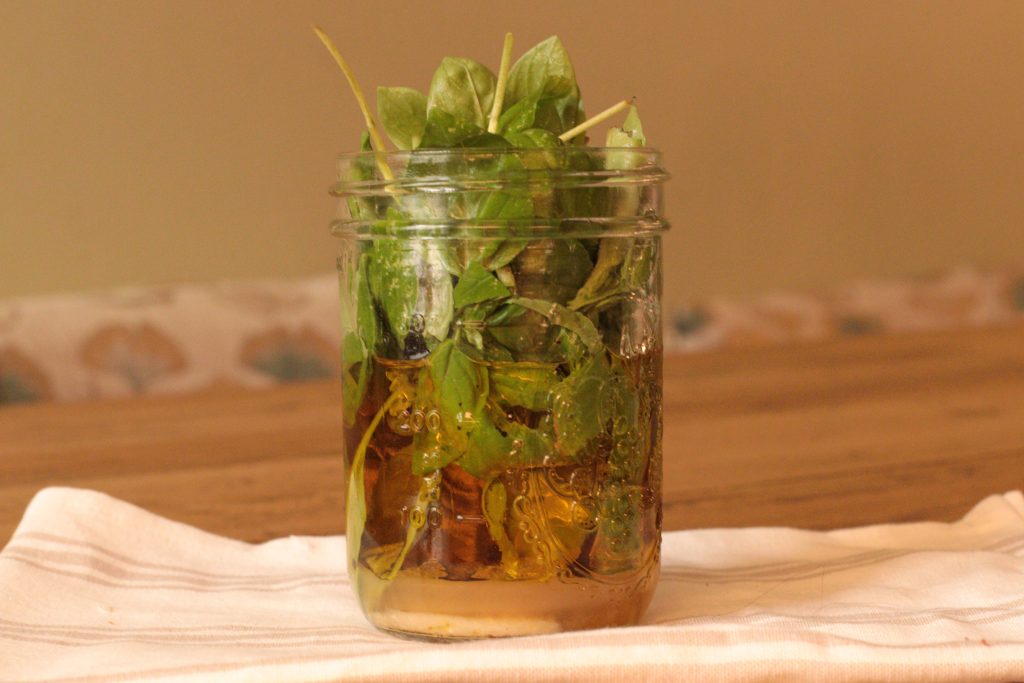basil, lemon juice and honey in a jar for sweet basil dressing
