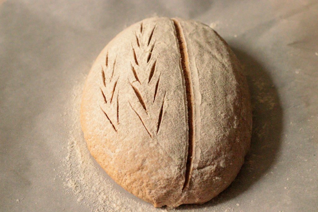 scored loaf of sourdough before baking